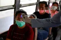 Public transport passengers in Thailand checked / Reuters