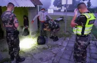 Літоўскія памежнікі вяртаюць мігрантаў у Беларусь / Reuters