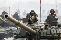 Soldiers on tanks taking part&nbsp;in Armed Forces Day parade in Myanmar / Reuters