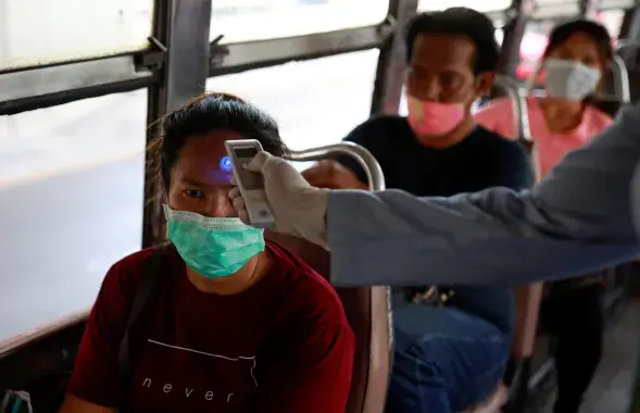 Public transport passengers in Thailand checked / Reuters